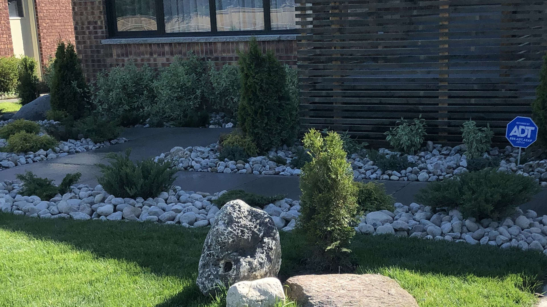 Modern stonescape and walkway design, a housefront project. Modern landscaping project in London Ontario.